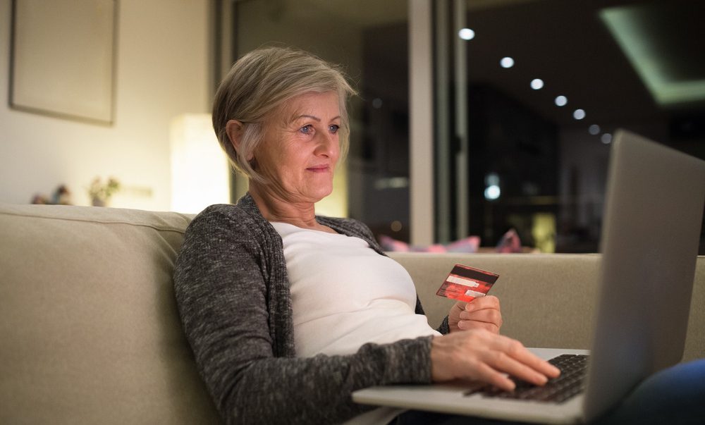 Senior woman making online shopping- safe online shopping webinar