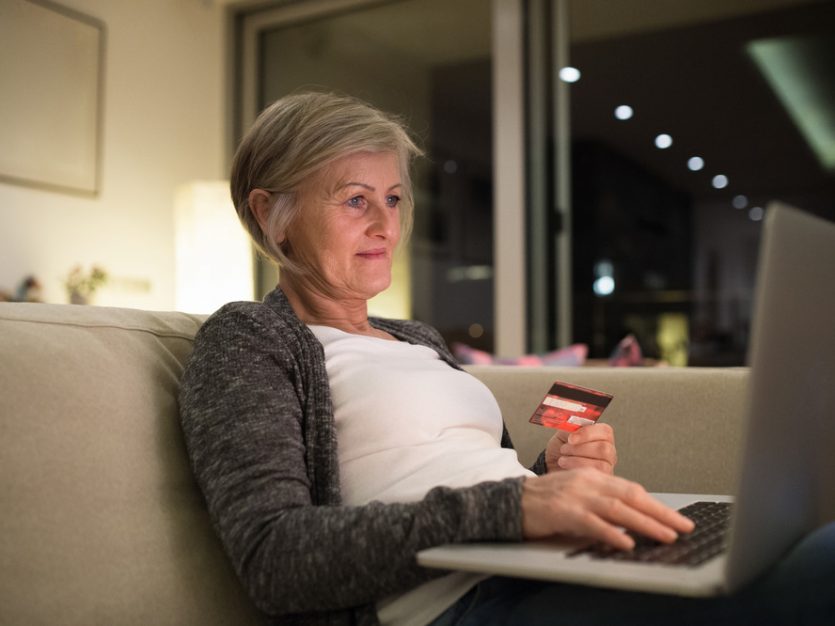 Senior woman making online shopping- safe online shopping webinar