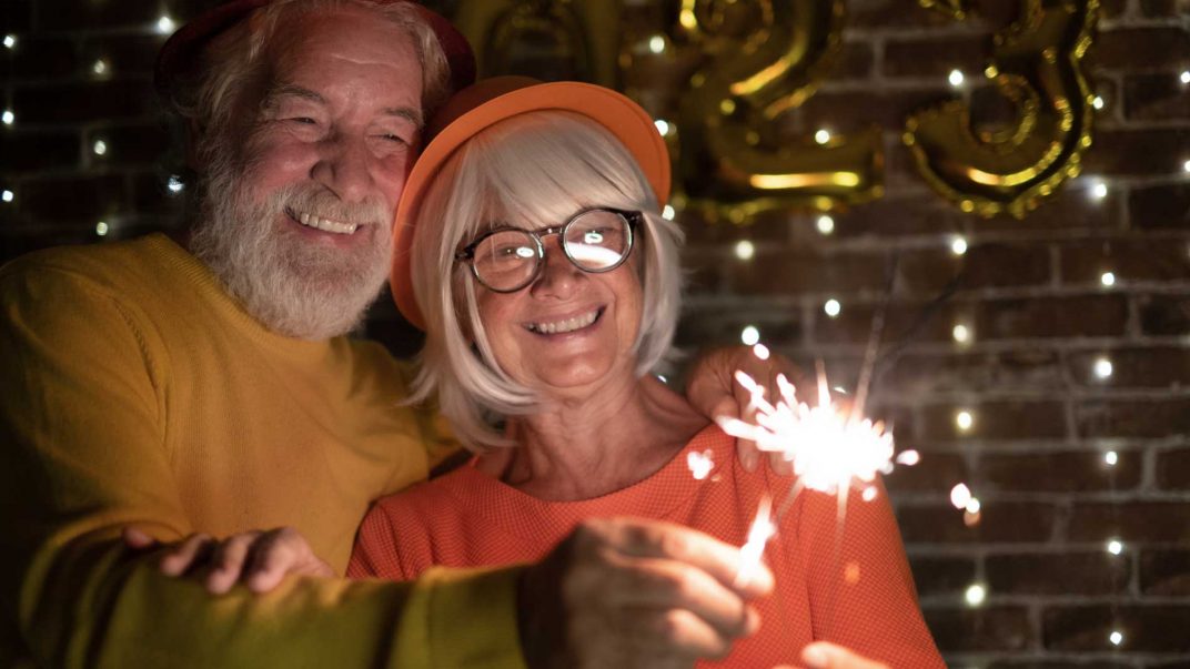 Thriving in 2025: 5 ways to stick with your health goals 1 senior couple celebrating new year