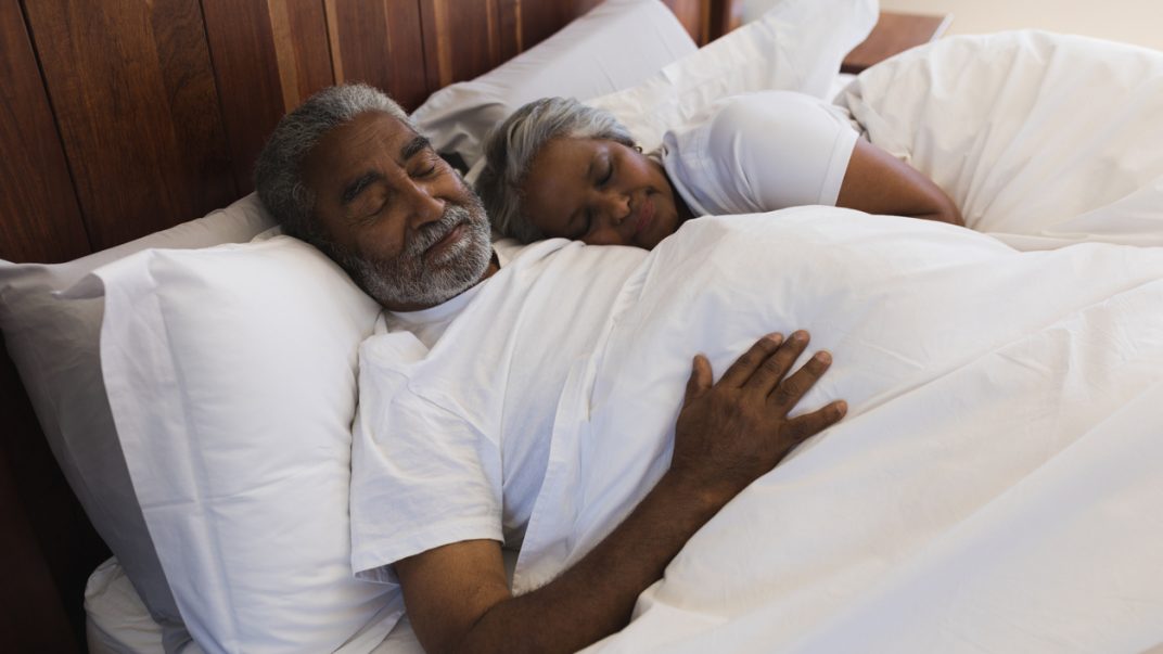 Looking to catch some quality zzz’s? Let’s talk music! 1 Older adult female and male sleeping in bed.