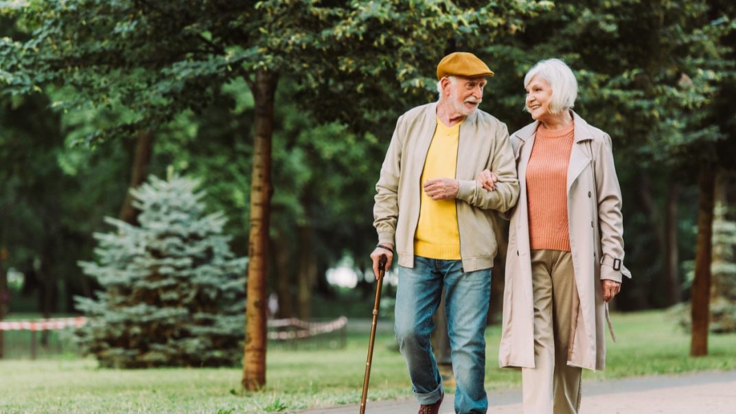 Seeing through the smoke: The impacts of quitting and quitting strategies in 3 populations 1 Elderly man and woman walking through a park linking arms.