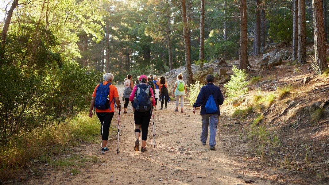 Group of older adults hiking.
