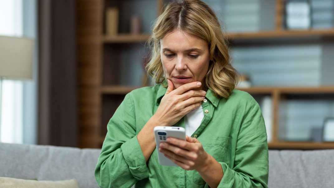 Supporting Bereavement in Later Life: What Older Adults Need to Know 1 A woman looking at a phone
