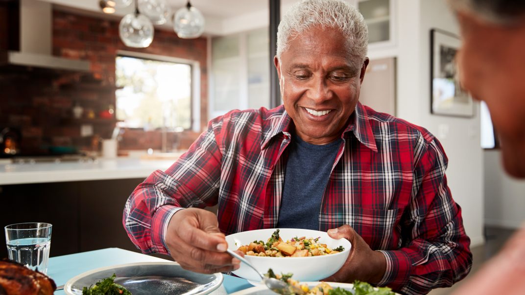 Elderly man enjoying a meal - meal delivery