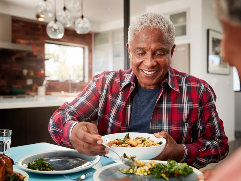 Elderly man enjoying a meal - meal delivery
