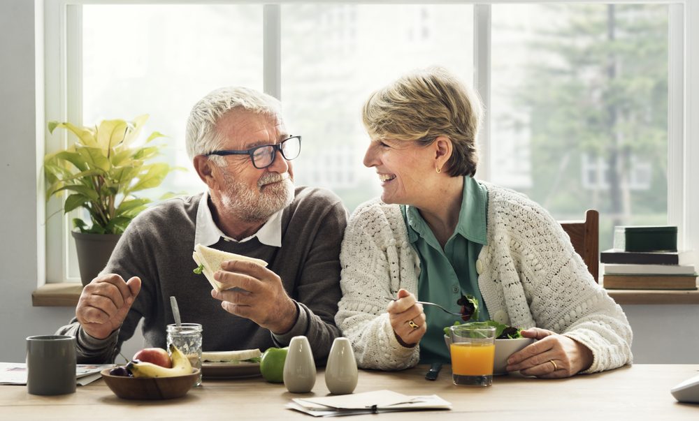 Elderly couple enjoying a meal together - Eating well