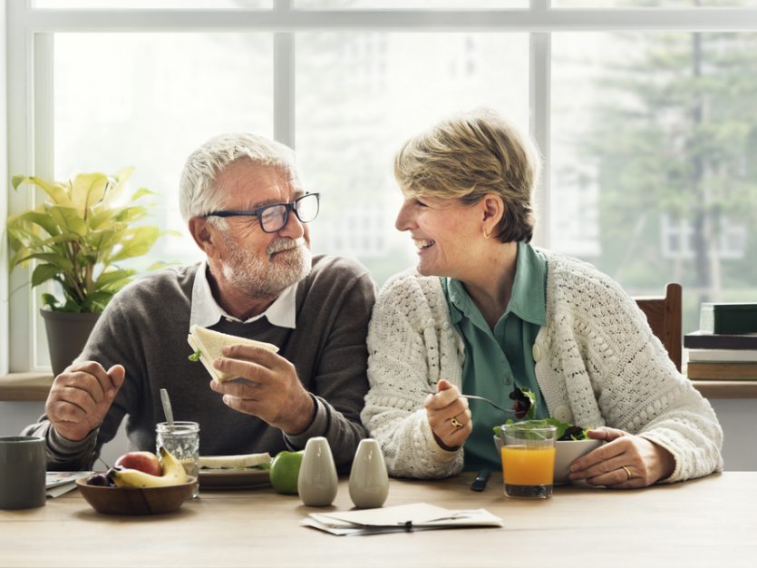 Elderly couple enjoying a meal together - Eating well