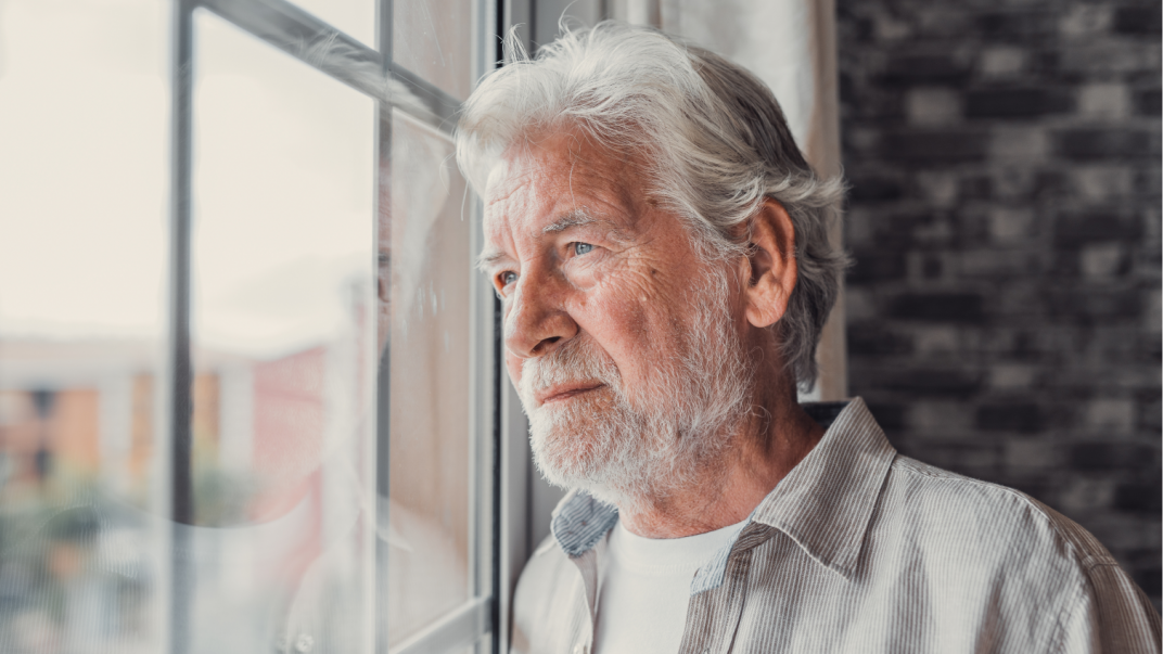 Mental Health and Aging Well at Home: What Seniors & Caregivers Should Know 1 Elderly man gazing out window. - mental health and aging