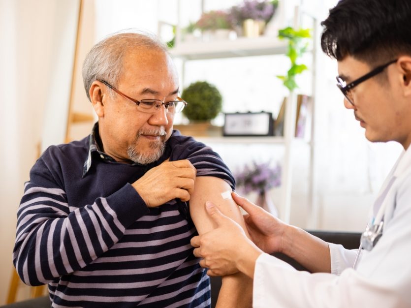 Senior man getting a flu shot